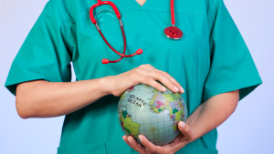 Photo of healthcare professional holding a globe.